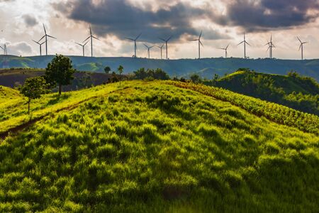 landscape image with Mountain and wind turbine panoramic view.の写真素材