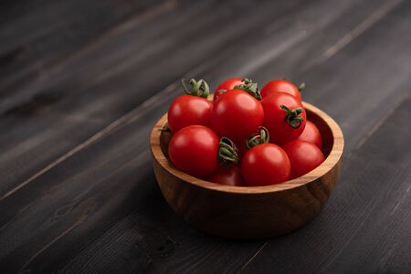 Red, ripe tomatoes on a dark background. Harvesting tomatoes.の写真素材