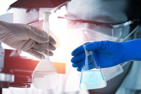scientist with equipment and science experiments ,Laboratory glassware containing chemical liquid, science research background.の写真素材