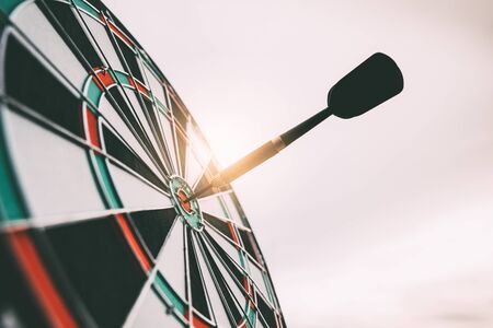 Bullseye is a target of business. Dart is an opportunity and Dartboard is the target and goal. So both of that represent a challenge in business marketing as concept.の写真素材