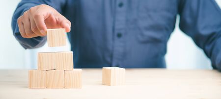 hand stack woods block step on table. business development Decide and choose concept.copy space.の写真素材