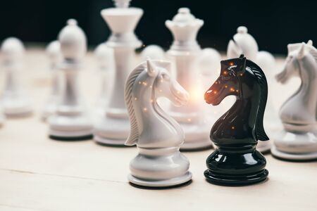 Chess knights head to head.black and white chess battle,Chess victory,chess concept. strategy, management or leadership concept.の写真素材