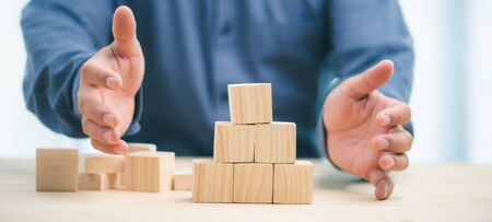hand stack woods block step on table. business development Decide and choose concept.copy space.の写真素材