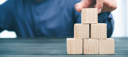 hand stack woods block step on table. business development Decide and choose concept.copy space.の写真素材
