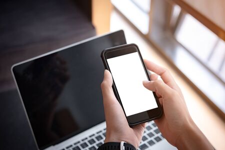 woman hand holding smartphone with blank screen for design or Advertisement.の写真素材
