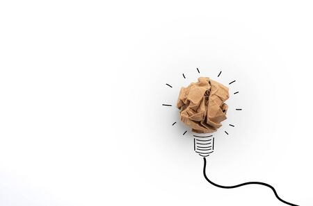 Idea with brown crumpled paper ball ( lightbulb ).Concept creative idea and innovation with paper ball.Doodle art concept,illustration paintingの写真素材