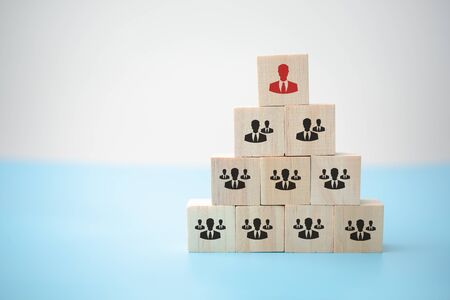 human resource management and recruitment business building team, organization and a leader with employees symbolized with cubes.の写真素材