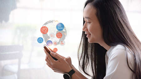 Social media interactions on mobile phone, concept with notification icons of like, message, email,...