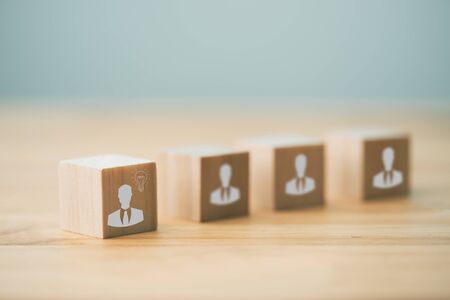 Human resources idea concept.  arranging wooden cubes with people icon on office desk.の写真素材