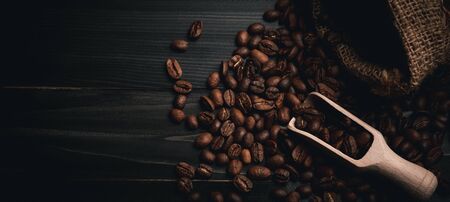coffee beans bag and scoop on old rusty background.with copy space for text or design and Advertisementの写真素材