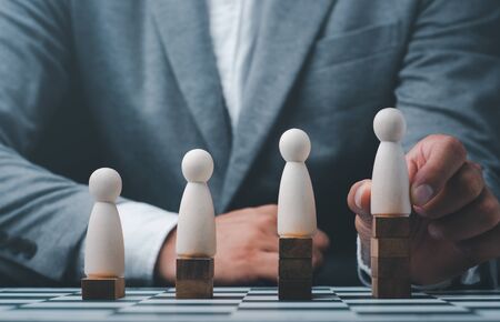 Businessman hand choose people with outstanding ability from the crowd,Successful team leader concept.の写真素材