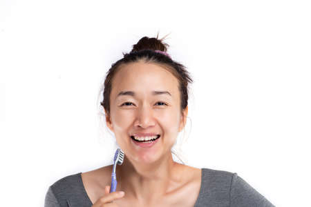 beautiful Thai woman brushing her teeth.gum and teeth care conceptの写真素材