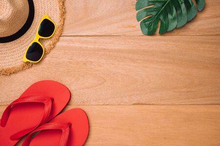 Beach accessories on wooden board topview with copyspace.concept of summer is coming.の写真素材