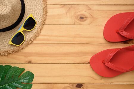 Beach accessories on wooden board topviewの写真素材