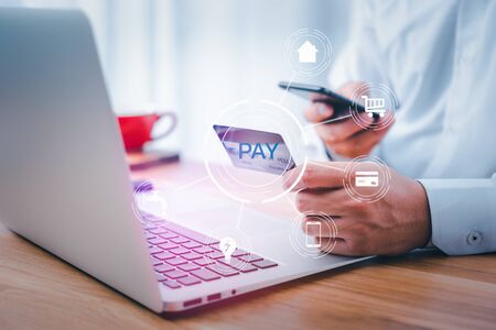 Business people using mobile phone with credit card and icon utility. Online payment concept,Pay utility bills,Mobile banking network,business technologyの写真素材