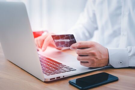shopping online payment by using laptop.hands holding credit card and using laptop. online shopping concept.の写真素材
