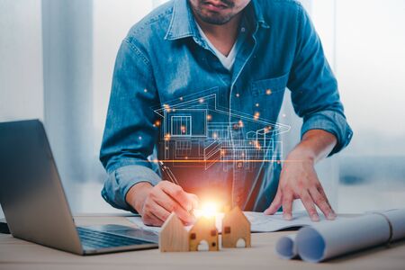engineers or architects is watching on model building and blueprint in working site.Construction and structure concept.concept of technology design.の写真素材