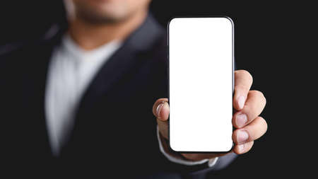 businessman showing smart phone with blank screen.の写真素材