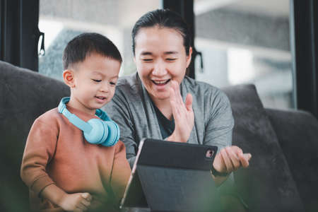 Online learning concepts Learn from home via the internet.Asian beautiful mother Encouraging a...