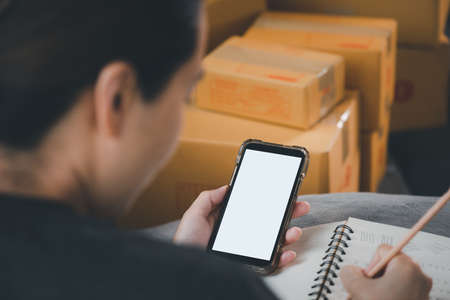 Online Selling or Online Shopping concept.Asian woman works at home by selling online and he is...