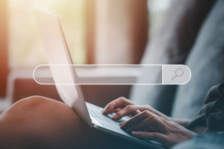 Searching Browsing Technology Internet Data Information Networking Concept. SEO Search Engine Optimization.hand of woman using computer laptop with Search Console on your website.の写真素材