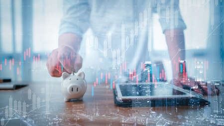 business finance technology saving and investment concept. Saving money effectively by investing in the stock market, funds and digital assets. Business people are choosing savings.の写真素材