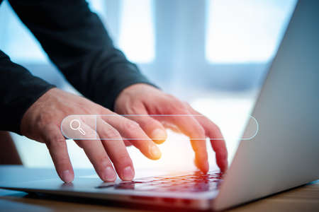 Data Search Technology Search Engine Optimization. man's hands are using a computer notebook to Searching for information.Using Search Console with your website.の写真素材