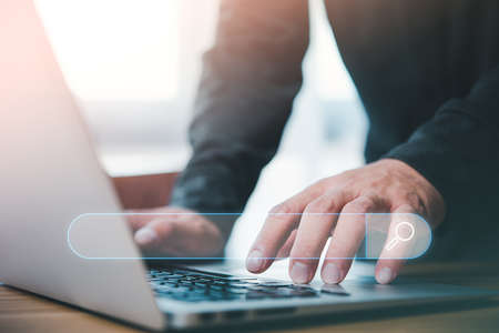 Data Search Technology Search Engine Optimization. man's hands are using a computer notebook to Searching for information.Using Search Console with your website.の写真素材