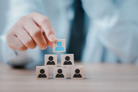 Business man or Employer chooses takes in hand employee. Leader stands out from crowd. Looking for good worker. HR, HRM, HRD conceptsの写真素材