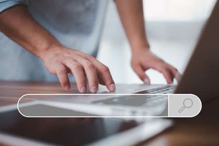 Data Search Technology Search Engine Optimization. male hands are using a computer notebook to...