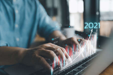 2021 business finance technology and investment concept. Stock Market Investments Funds and Digital Assets. businessman analysing forex trading graph financial data. Business finance background.の写真素材