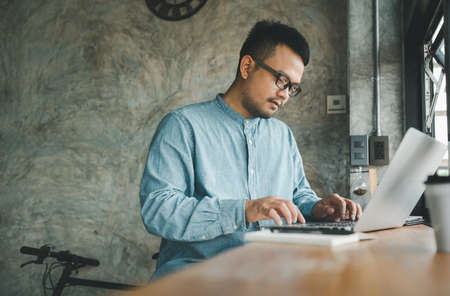 smart Asian man working with computer laptop. concept work form home, stay at home. freelance life style.の写真素材