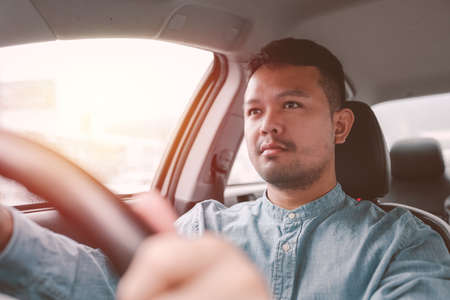 Car driver man close up is hands on  Car steering wheel. copy space.の写真素材