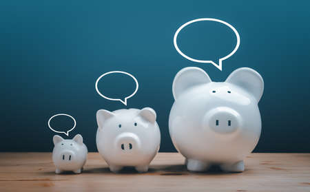 Income Management, expenses, invest, save, three white ceramic piggy bank on wood table. family Piggy Bank for saving and investment.の写真素材