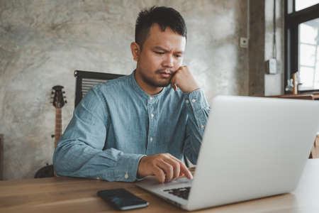 smart Asian man working with computer laptop. concept work form home, stay at home. freelance life style.の写真素材
