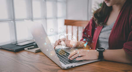 Woman using a laptop with World and big data network connection, World Wide Web, social networkの写真素材