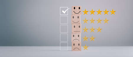 feedback rating and positive customer review experience, service and Satisfaction, wood block with 1 to 5 star icon to give satisfaction in service. rating very impressed. Mental Health Assessment.の写真素材