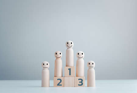 Business hierarchy; ranking and strategy concept with wood doll standing on a podium 1, 2, 3 of...
