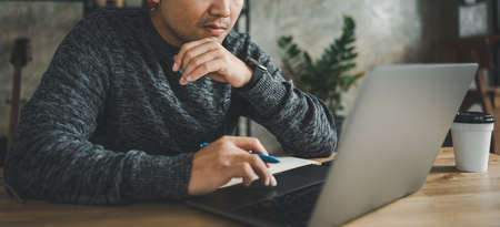 smart Asian man working with computer laptop. concept work form home, stay at home. freelance life...