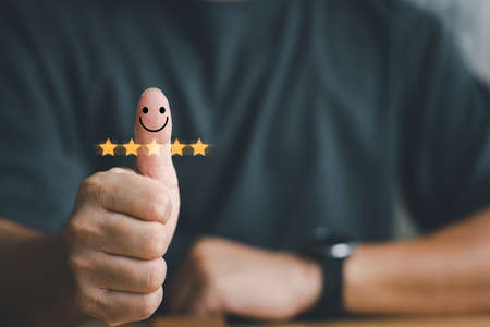 Customer experience satisfaction concept. Hand with thumb up Positive emotion smiley face icon and...