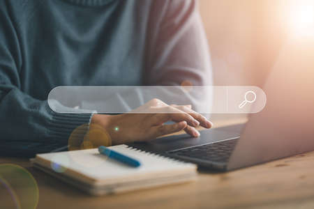 Data Search Technology Search Engine Optimization. woman's hands are using a computer keyboard to Searching for information. Using Search Console with your website.の写真素材