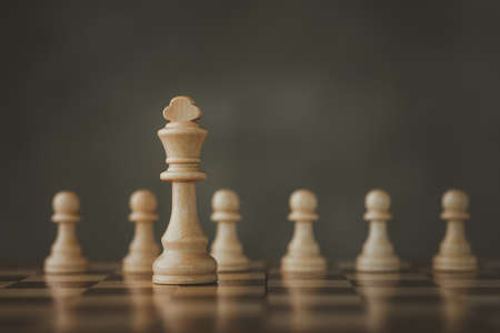 Close-Up Of Chess Pieces Against dark background, International chess, ideas and competition and strategy, business success concept, business competition planning teamwork strategic concept.の写真素材