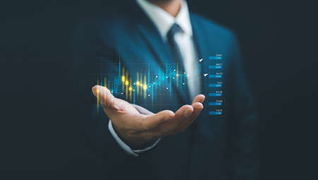 planning and strategy, Stock market, Business growth, progress or success concept. Businessman or trader is showing a growing virtual hologram stock, invest in trading.の写真素材