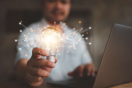 idea concept and light bulbs with connection line, businessman show new ideas with innovative...