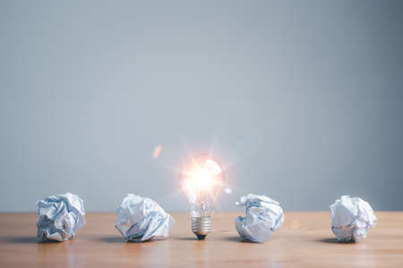 Great idea concept, light bulb and crumpled office paper. Concept of inspiration creative idea...
