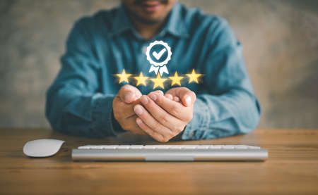 Hand shows the sign of the top service Quality assurance 5 star, Guarantee, Standards, ISO...
