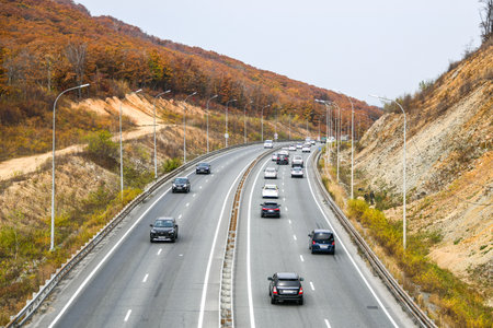 Cars on the highway in the autumn. Russia.の写真素材