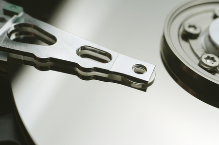 Opened hard drive close up, contrast light