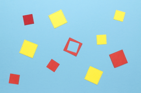 red and yellow squares on a blue backgroundの写真素材