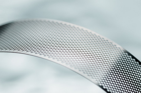 Metal perforated tape, curved abstract